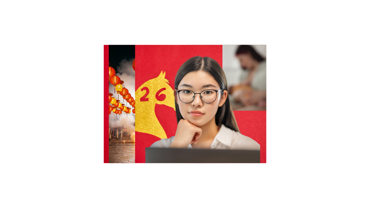 Woman with straight black hair in front of a computer wearing glasses